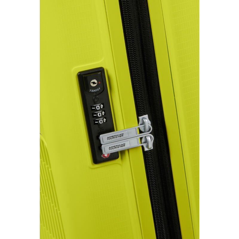 American Tourister AeroStep Spinner 4-kerekes keményfedeles bővíthető bőrönd 77 x 50 x 29/32 cm, világos lime