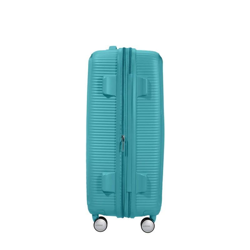 American Tourister Soundbox 4-kerekes keményfedeles bővíthető bőrönd 67 x 46.5 x 29/32 cm, türkiz