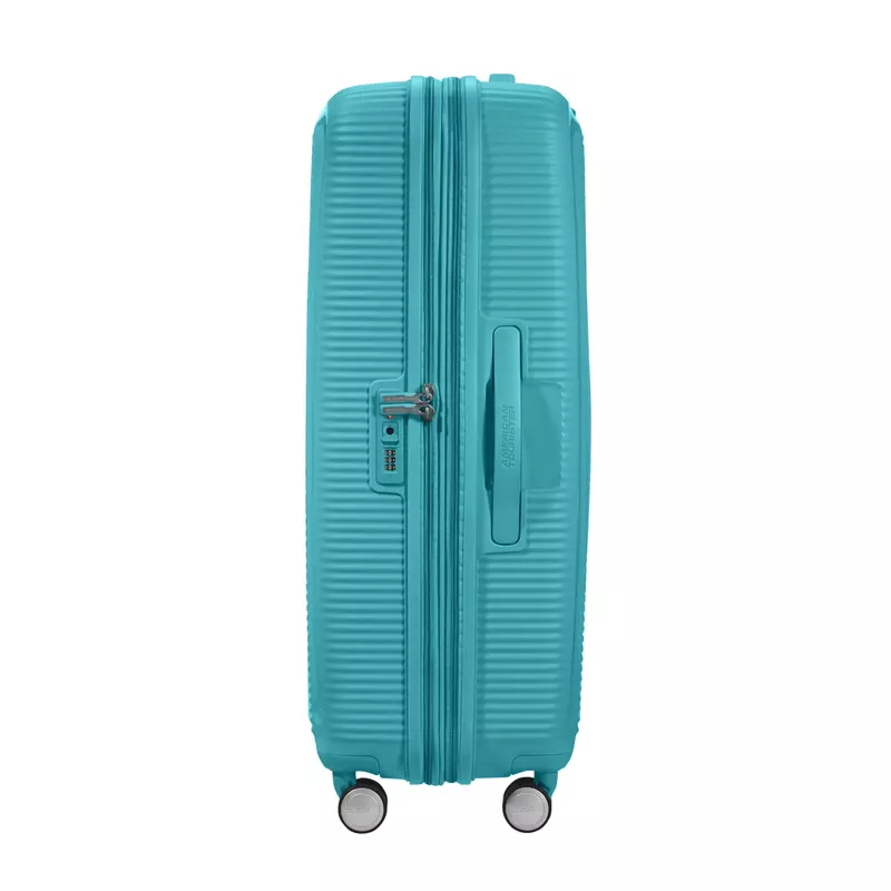 American Tourister Soundbox 4-kerekes keményfedeles bővíthető bőrönd 77 x 51.5 x 29.5/32.5 cm, türkiz