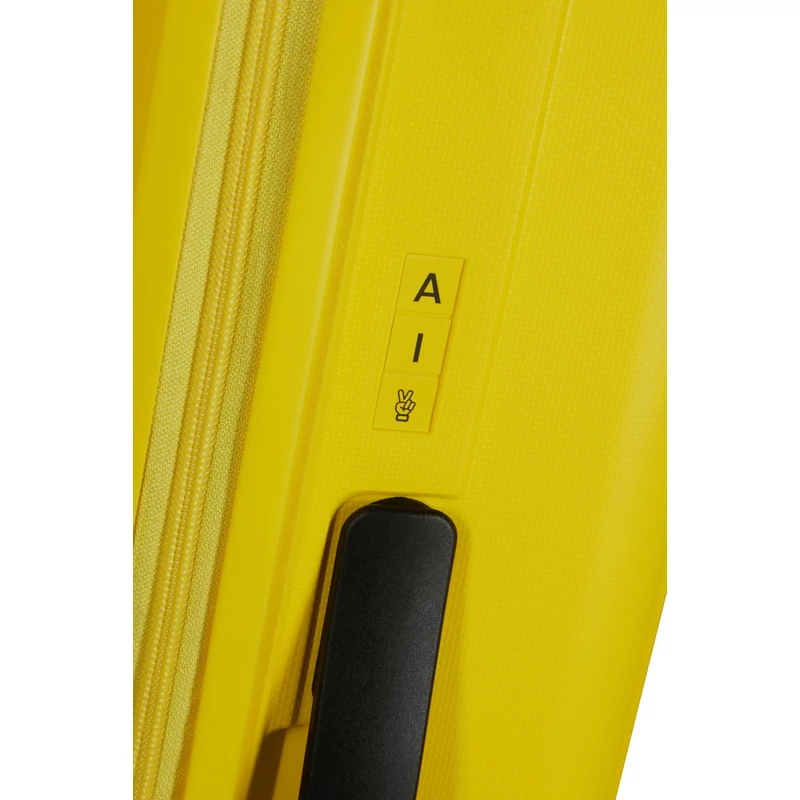 American Tourister Rejoy 4-kerekes keményfedeles bőrönd 68 x 47 x 26 cm, sárga