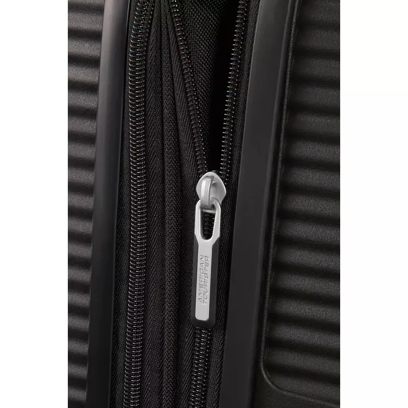 American Tourister Soundbox 4-kerekes keményfedeles bővíthető kabin bőrönd 55x40x20/23 cm, fekete